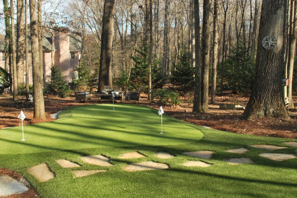 Toronto backyard putting green with flags and trees